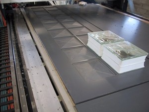 An 18 block mould on the machine (i.e. holds 2 rows of 9 glass blocks)